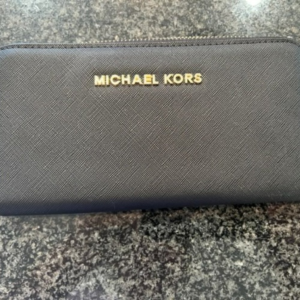 Michael Kors Brand New black wallet. Never used.